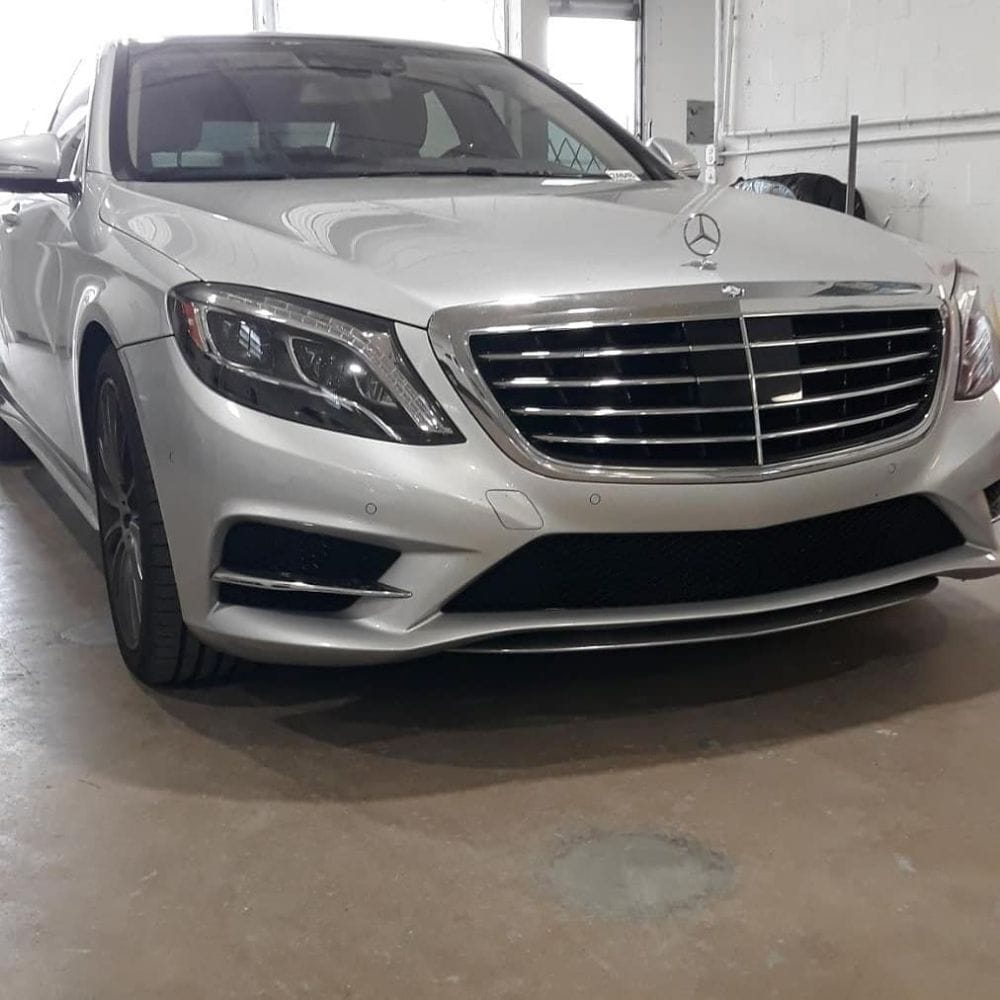 SUV with front end disassembled for collision repair at Auto Shop Repair