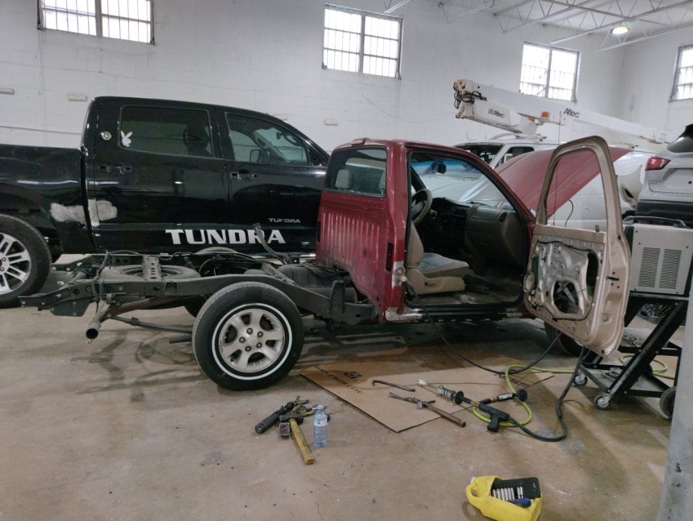 Trucks in progress on the Auto Shop Repair shop floor